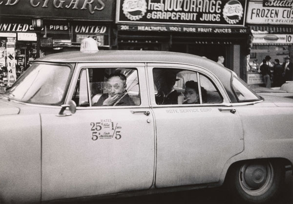 Diane Arbus, Taxicab driver at the wheel with two passengers, N.Y.C © The Estate of Diane Arbus, LLC. All rights reserved.