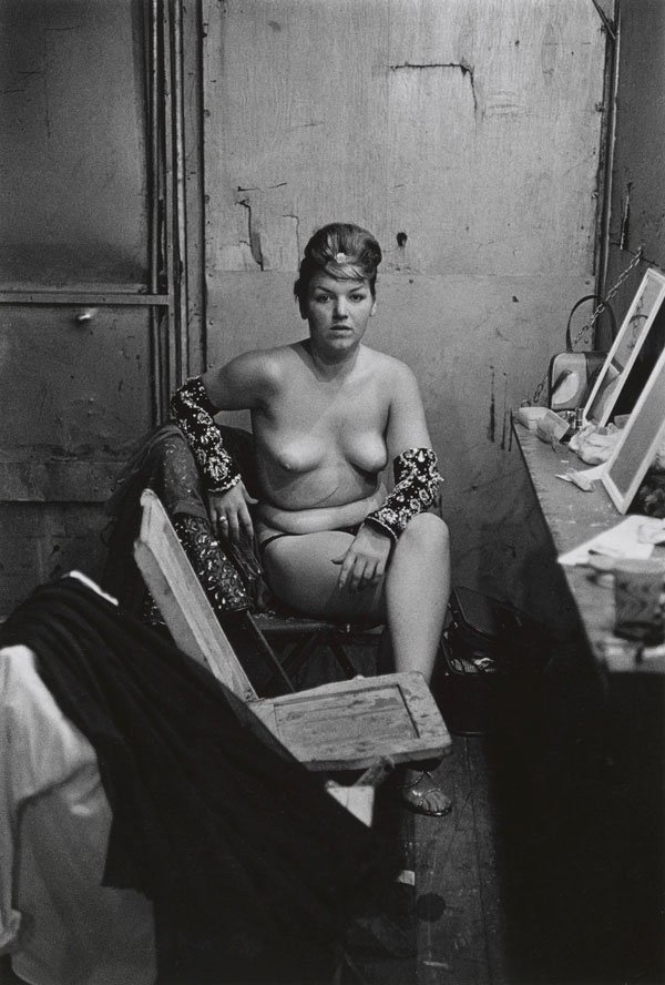 Diane Arbus, Stripper with bare breasts sitting in her dressing room, Atlantic City, N.J © The Estate of Diane Arbus, LLC. All rights reserved.